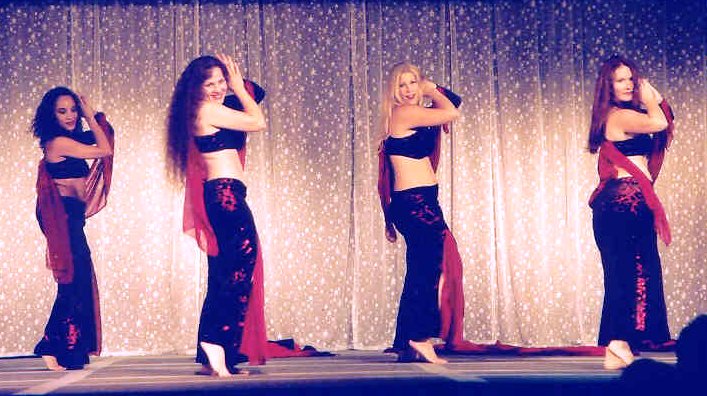 group of dancers in red and black